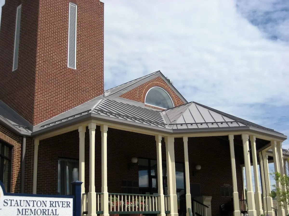 Skilled roofing craftsmen working on a residential roof in Whiting